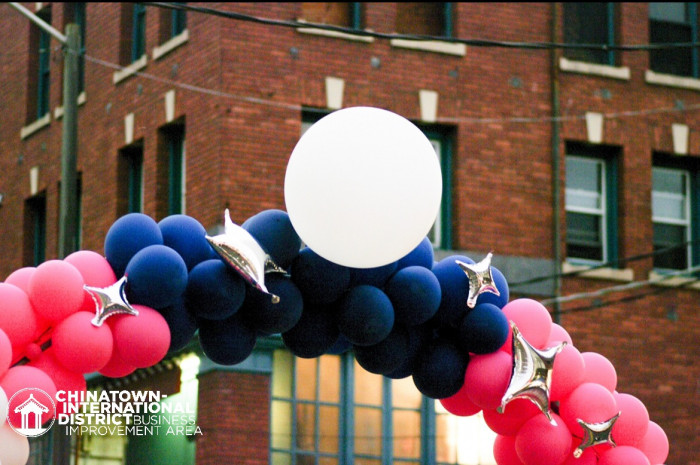 CID Night Market banner balloons
